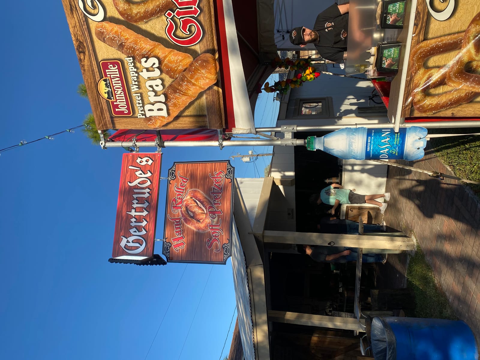 Adding coarse sea salt to freshly baked pretzels
