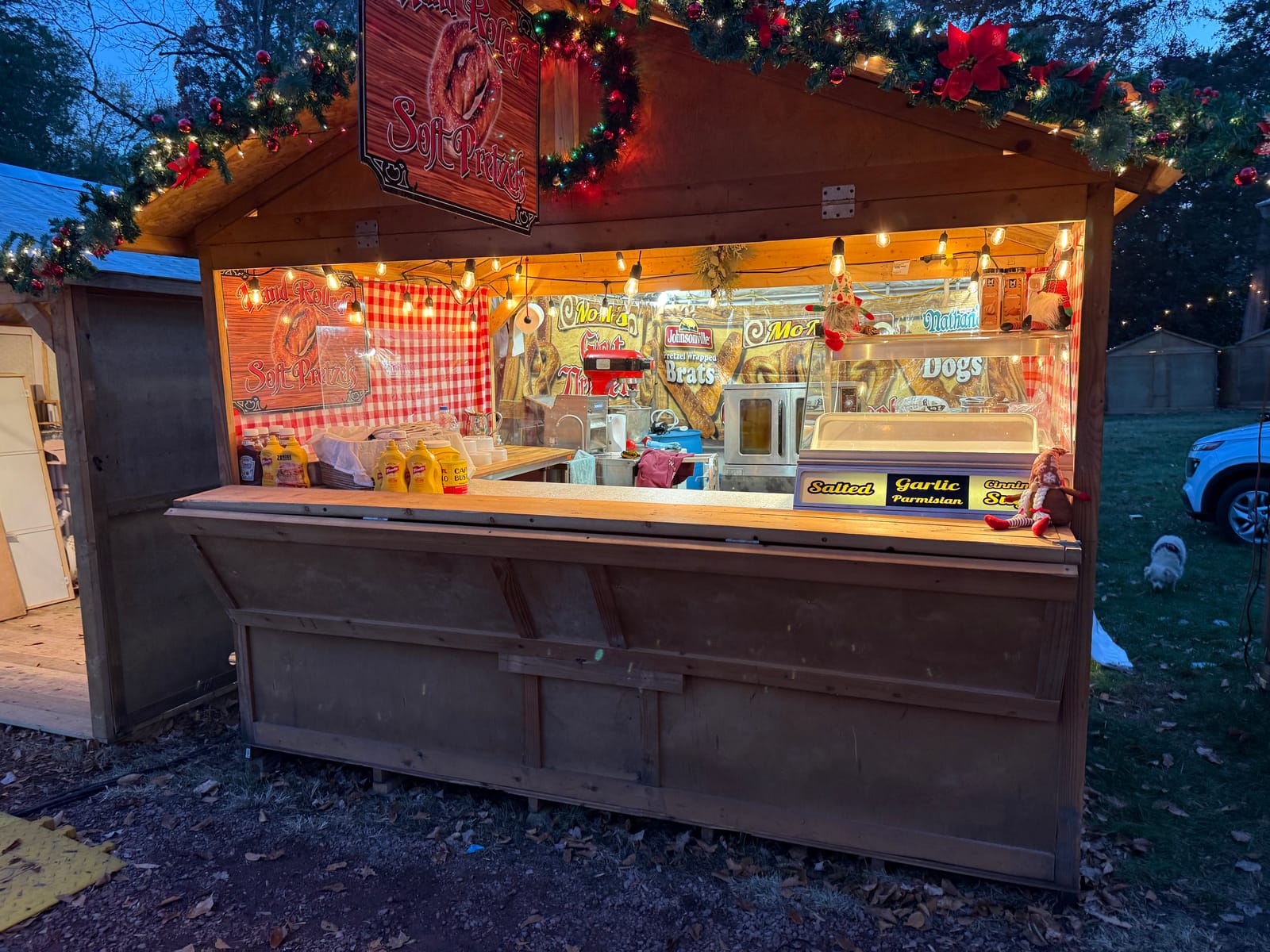 Momo's Pretzels booth at the farmers market with customers